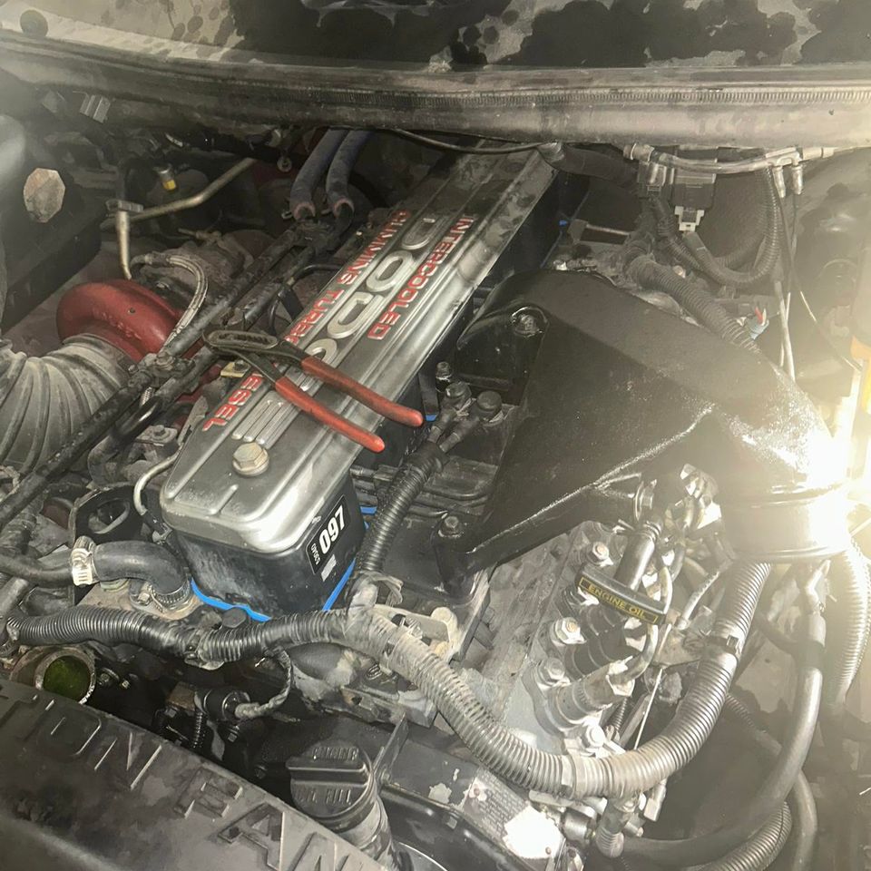 Dodge Cummins intercooled turbo diesel engine bay during truck service in Arab Alabama