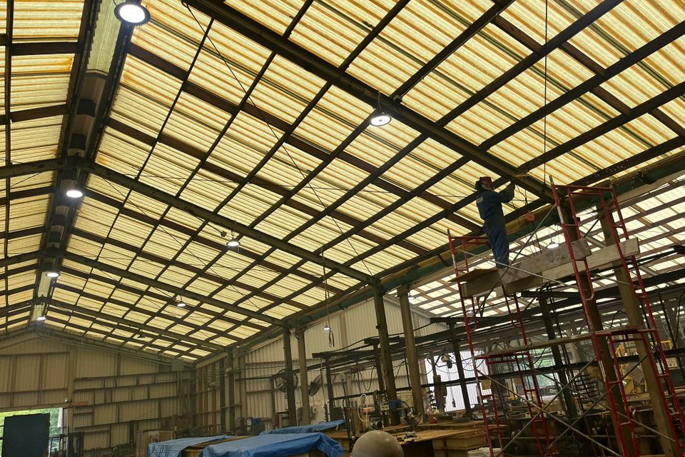 Marquez Welding installing steel support beams for crane system in Houston industrial building