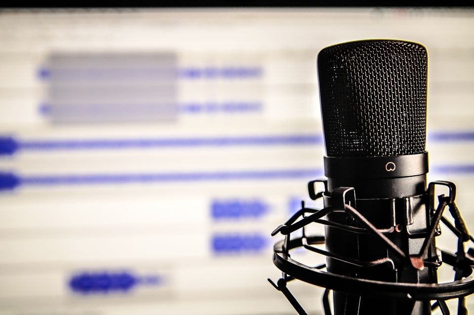 Microphone in front of computer screen