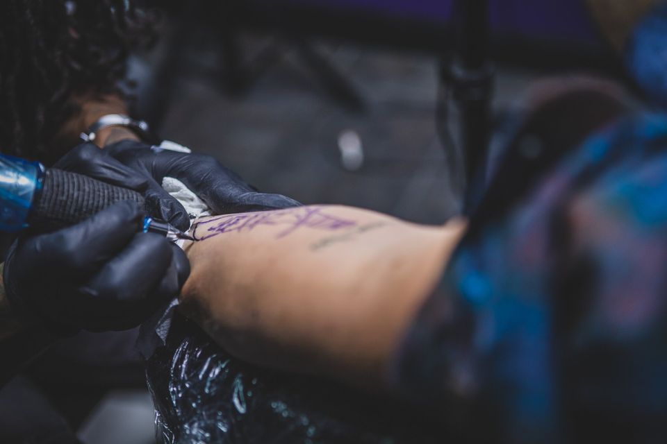 Tech tattooing closeup
