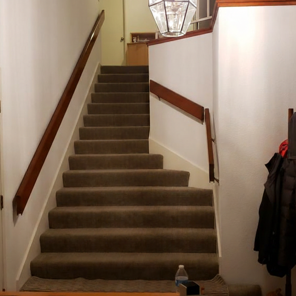 Elegant patterned berber carpet featuring a soil-resistant finish and expert seam integration for a high-traffic home hallway.