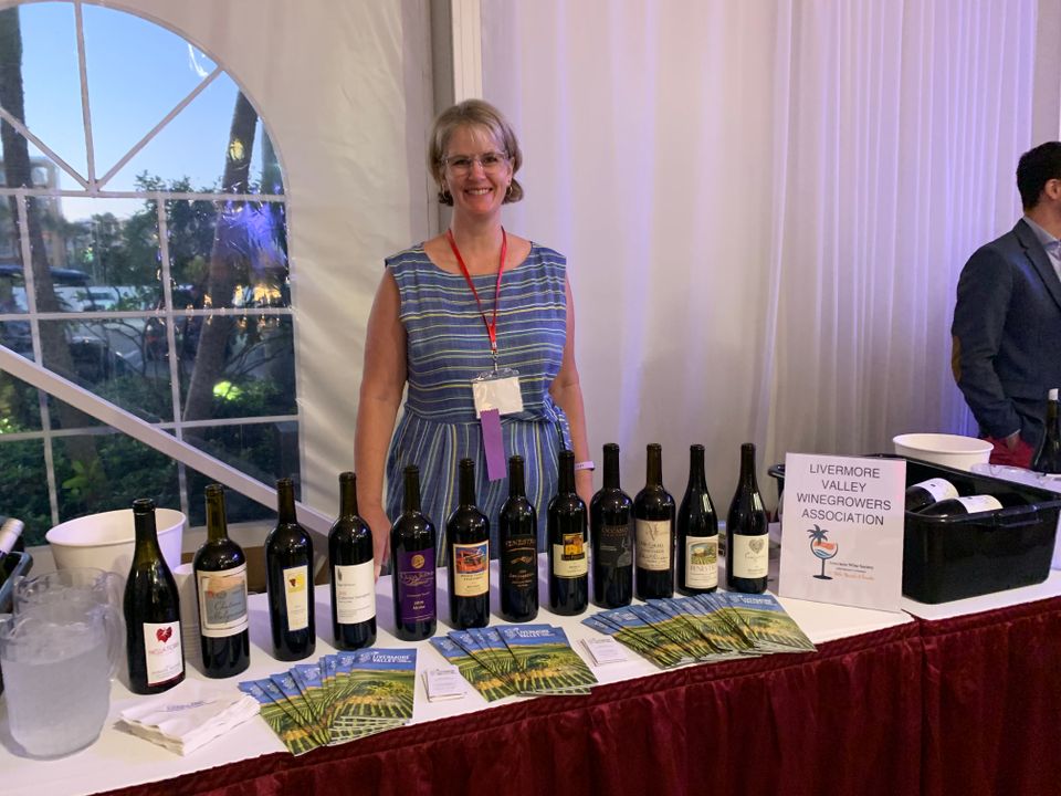 Tami pouring at wine conference