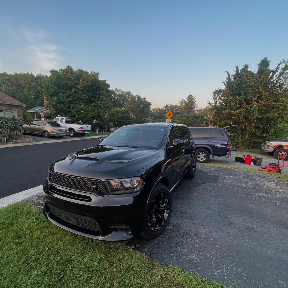 Black Dodge Durango with a deep gloss finish after a mobile exterior detail in a Wilmington neighborhood