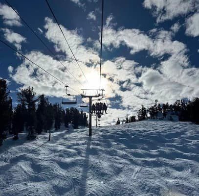 Photo of chairlift from the perspective of someone on the chairlift