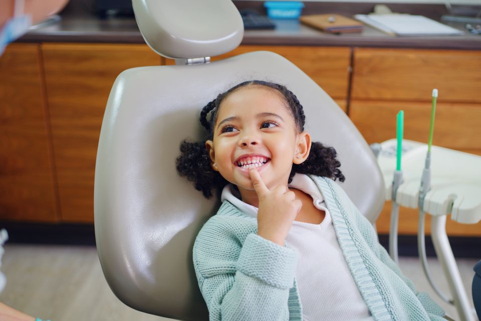 Young child smiling during pediatric dental visit