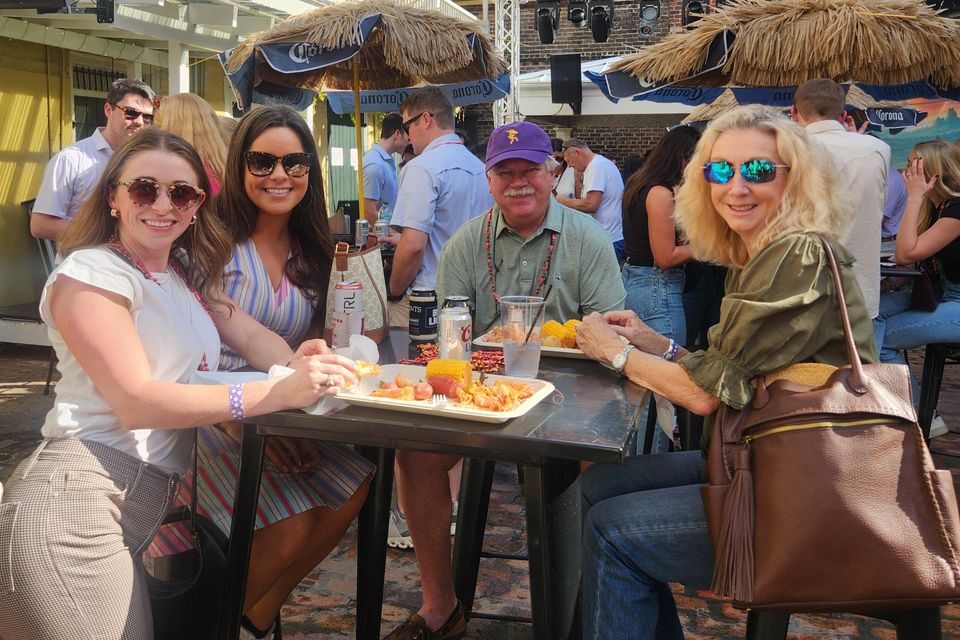 Patrons at a table enjoying one of Carpe Diem Events' corporate shrimp boils.