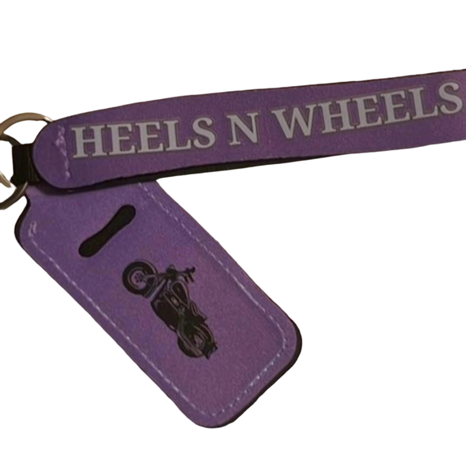 Purple Heels 'n Wheels keychain featuring brand lettering and a motorcycle graphic.