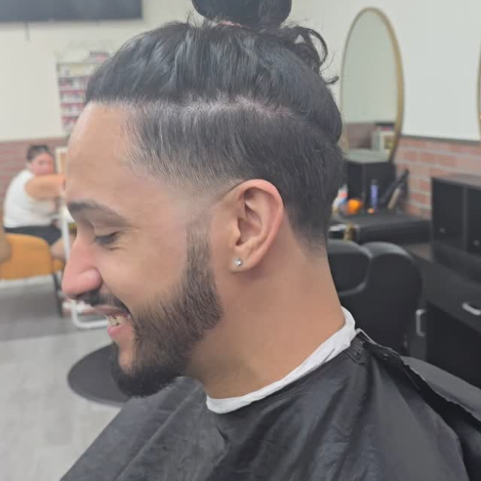 Slick back haircut with mid fade and beard lineup at Jeff Barber Services in Bronx NY