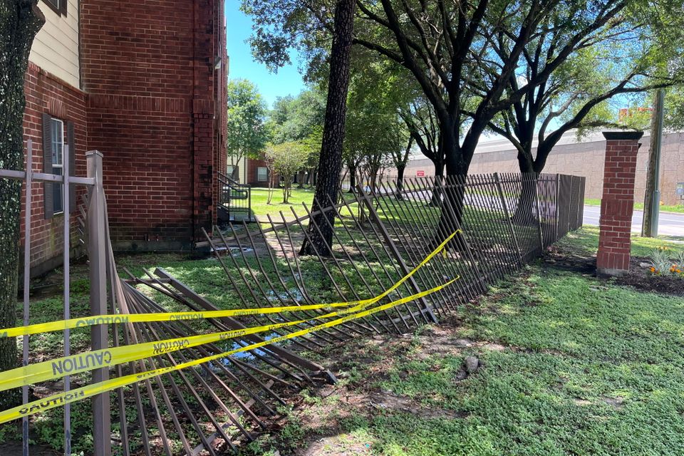 Severely damaged iron fence requiring repair and replacement by Marquez Welding in Houston.