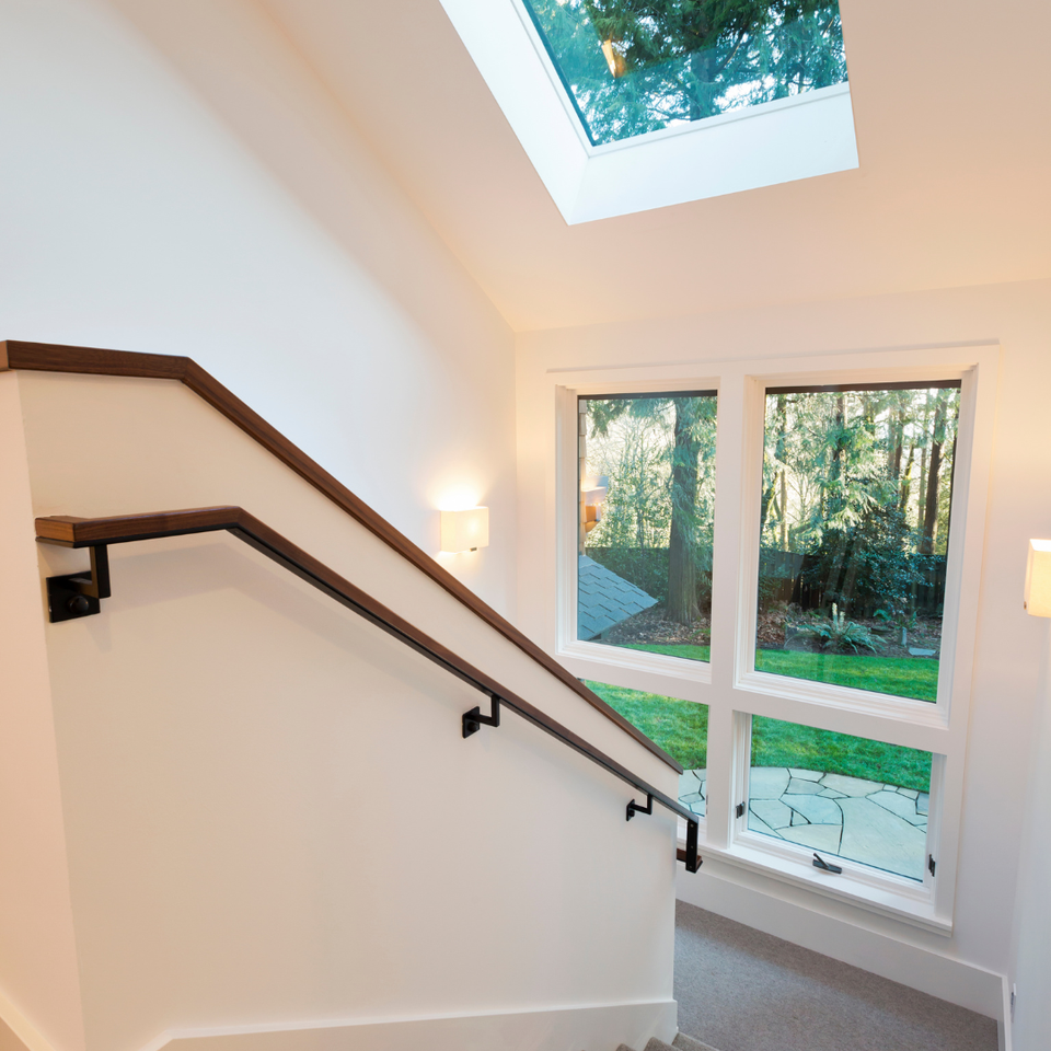 Staircase with a skylight that brings natural light into the home's interior.