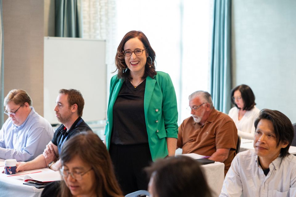 Woman standing speaking to group