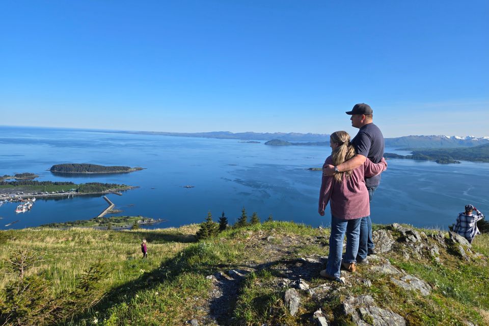 Kim with arm around son