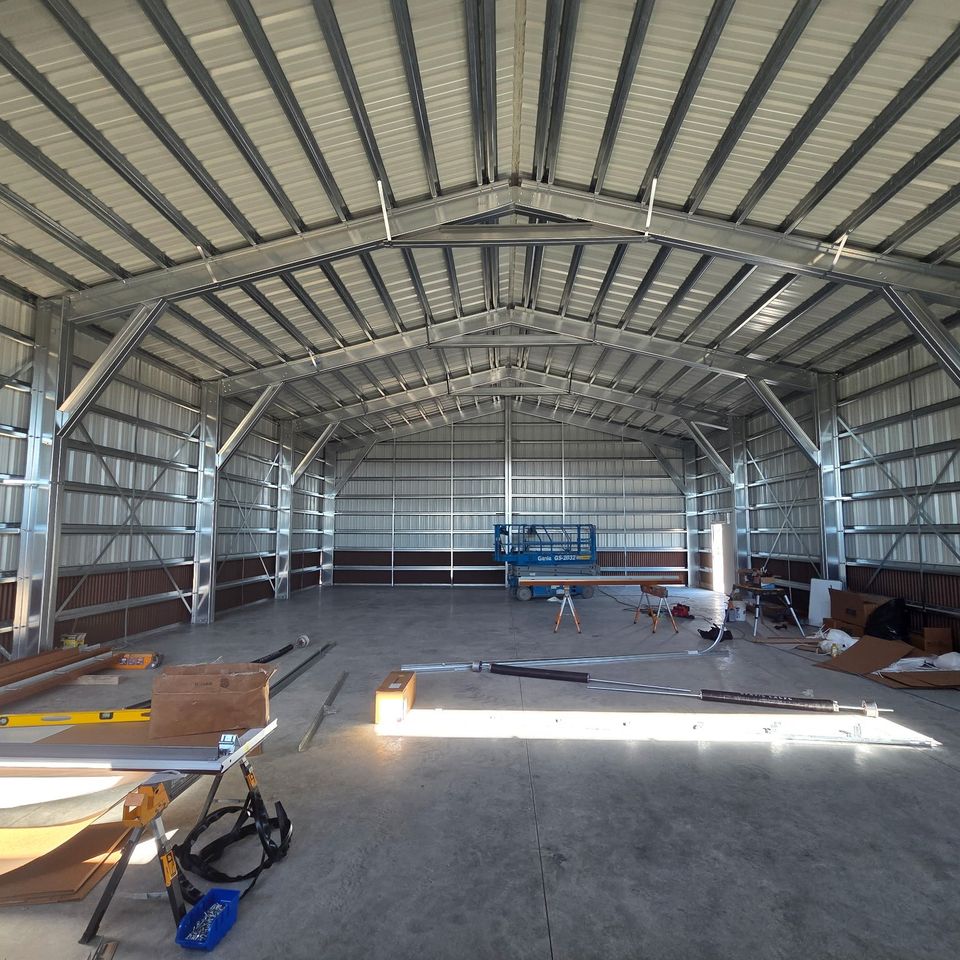 Finished metal building interior with clear span steel framing and poured concrete slab in Trout Creek MT