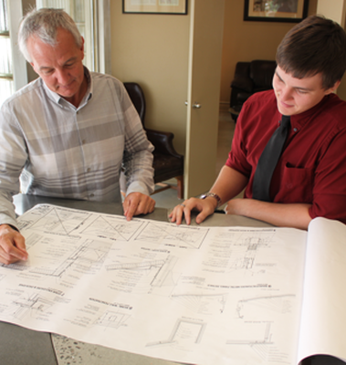 Barron and mcclary gc   tulsa  oklahoma   general contractors   about us   kurt and grant looking at plans20170727 2497 ndbw2g