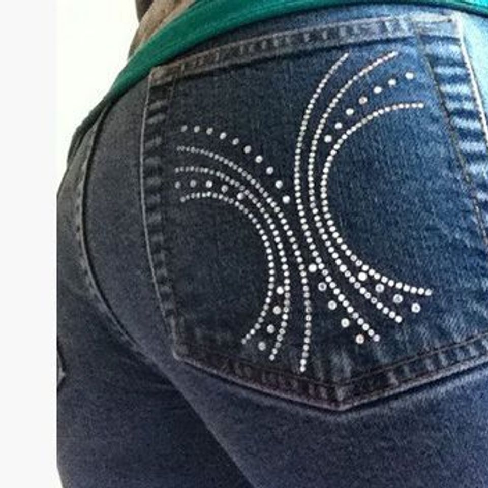 Rhinestone Bling design on back pocket of woman wearing jeans