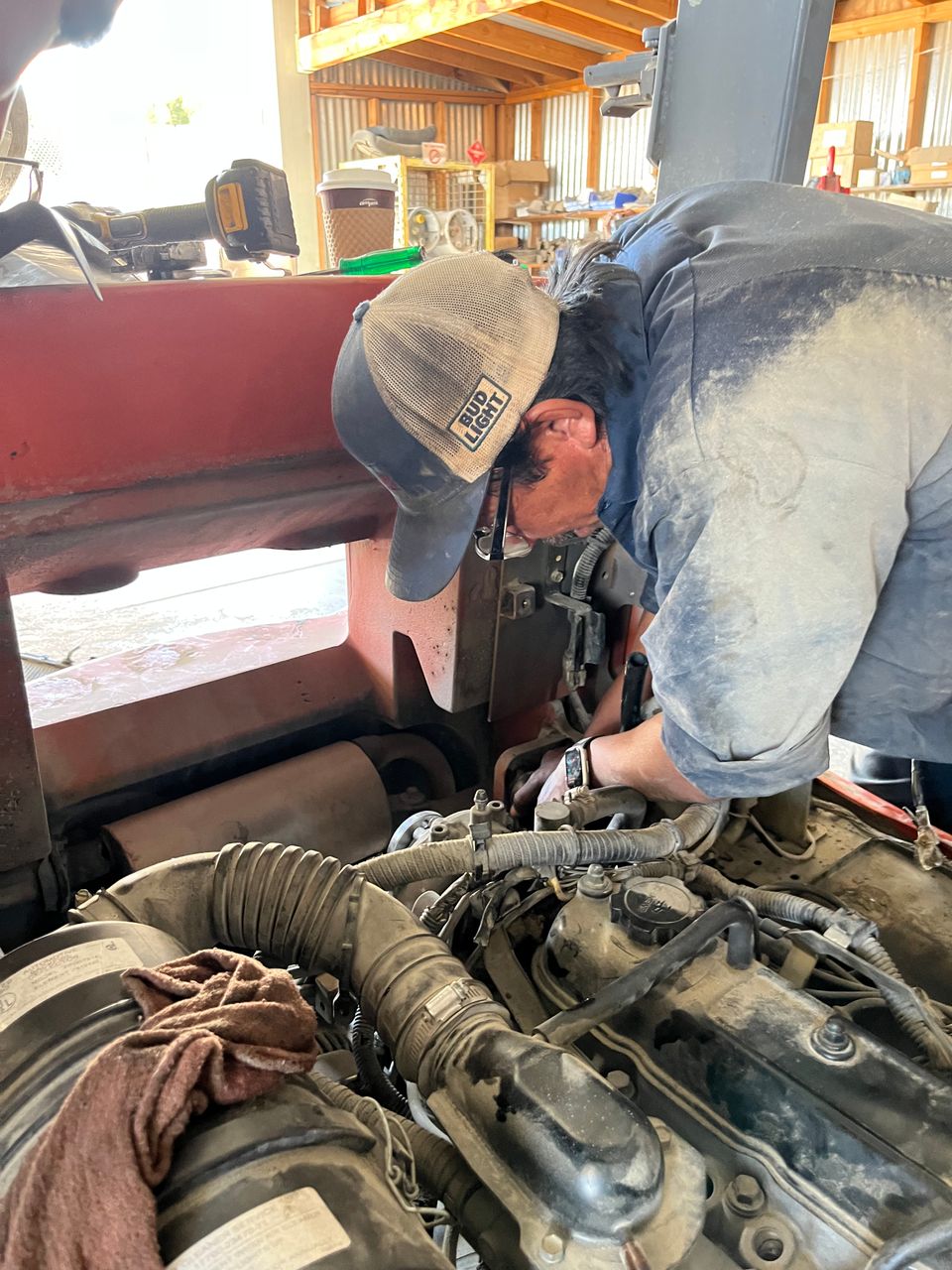Image of John troubleshooting a forklift