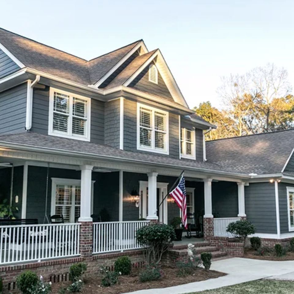 house with siding and masonry work