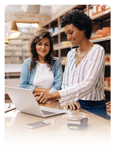 Two women reviewing an insurance policy