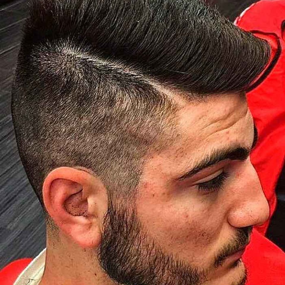 Sal and gabis barbershop fade with part guy