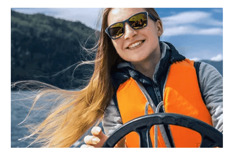 Woman driving boat