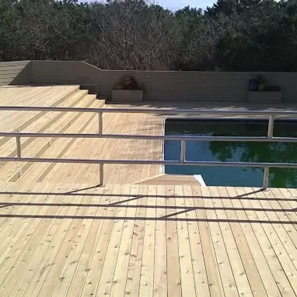 Newly installed deck with pool, done by Taurus Contracting of Suffolk County, NY