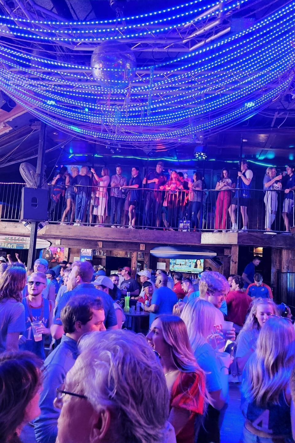 “Kansas fans packed inside a Bourbon Street venue during a Carpe Diem Events pre-game fan party in New Orleans