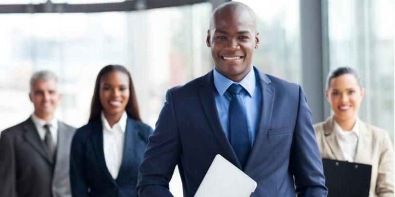 African businessman with group of businesspeople picture id480248229