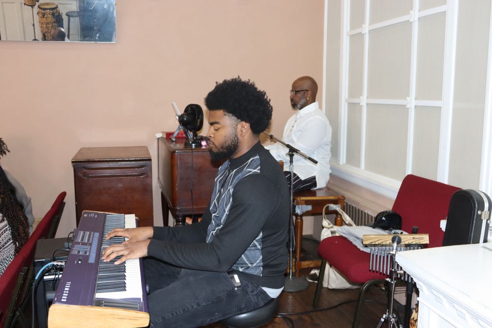 Organist playing music at Open Bible Church in Baltimore, MD
