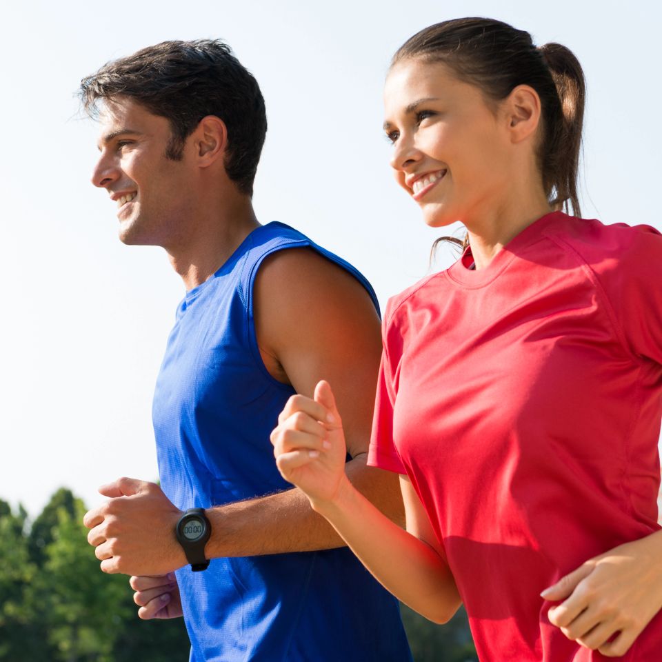A Couple Jogging At the Park In Early Morning