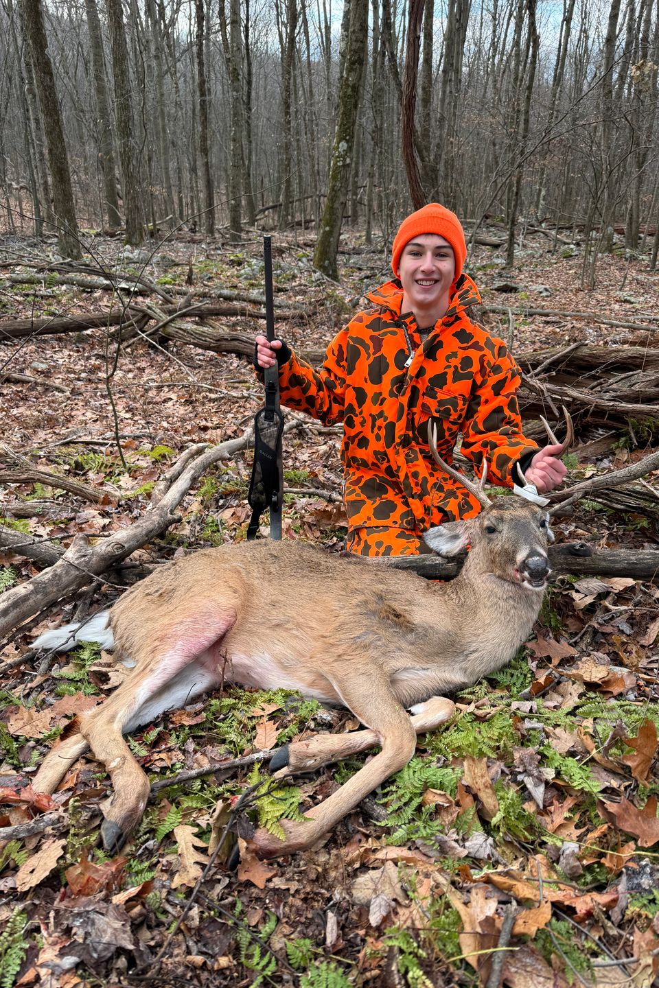 Kenny Rothacker with his first buck taken on public land opening day, from a ground blind made of sticks, with a 6.5 Creedmore rifle.