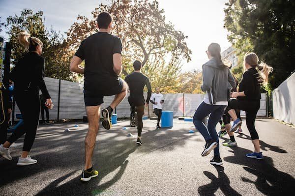 Group exercise class outdoors. 
