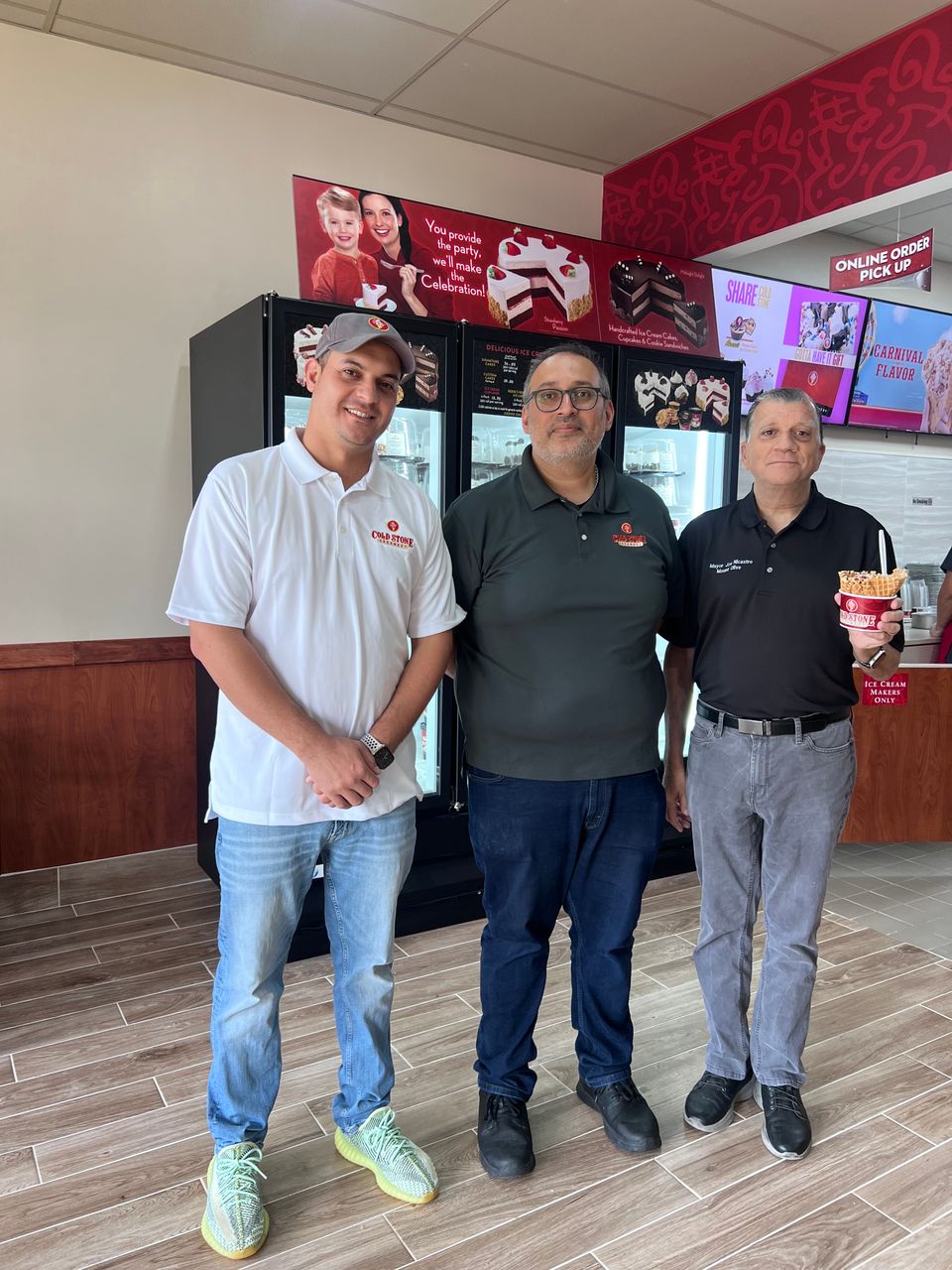 Mohamed  haggag owner of cold stone amit tikyani regional director of operations and mayor joe nicastro 