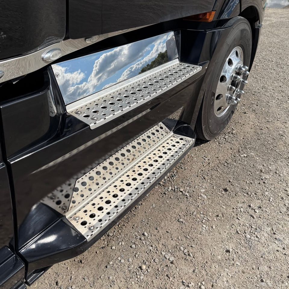 olished chrome steps and trim on a black truck after a detailed exterior wash