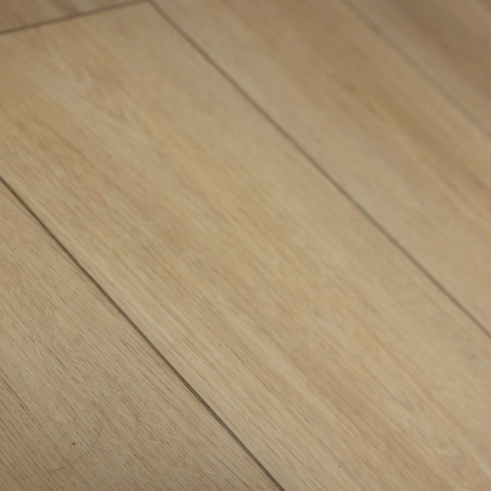 Close-up of light white oak-look luxury vinyl plank flooring