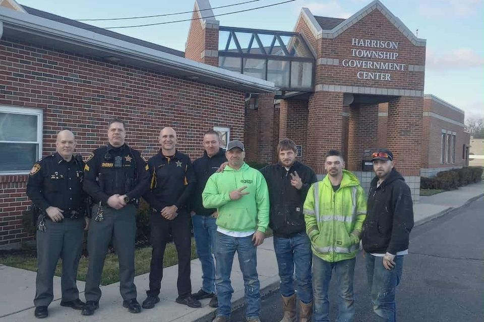 Ohio Concrete team posing with officers outside the Harrison Township Government Center.