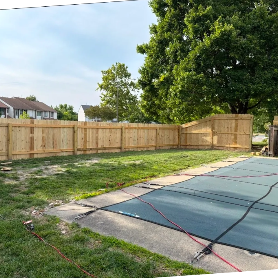 Wood privacy fence installation along backyard property line near pool in Virginia Beach VA 