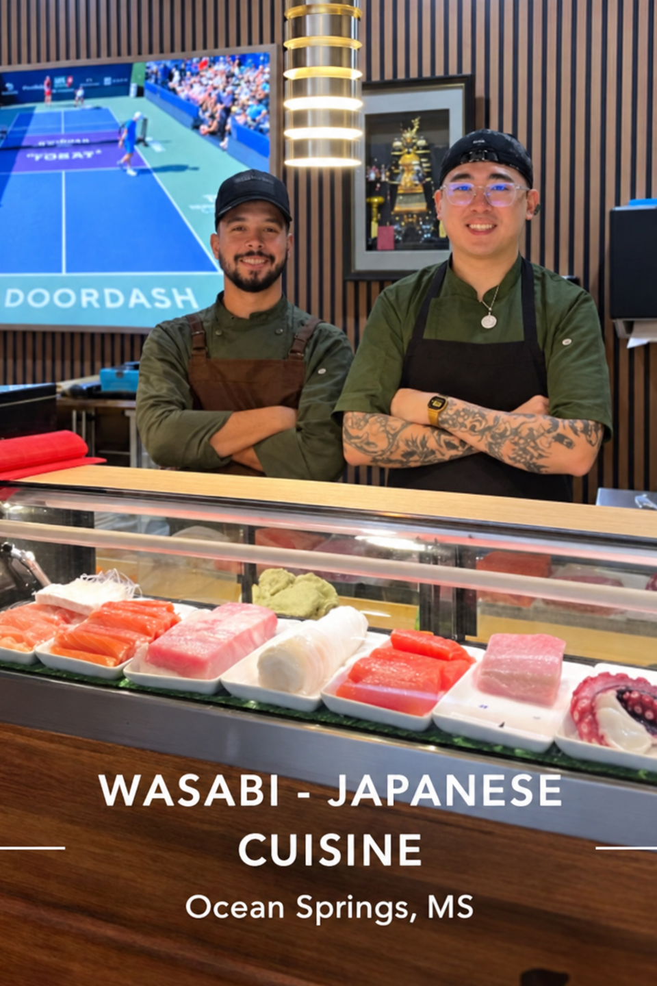 Sushi chefs behind the wasabi counter