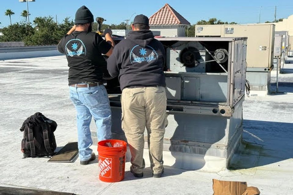 Repairing and replacing commercial air conditioners on the roof of a commercial building.