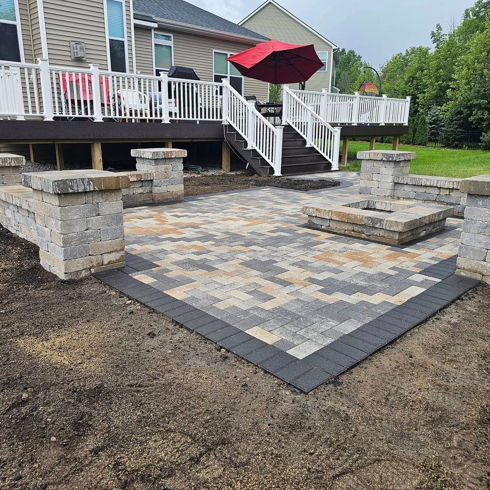 Hardscaping work, including a fire pit, installed by Vic's Landscaping