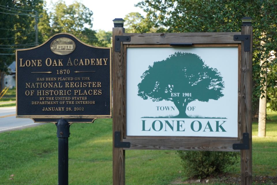 Lone oak sign and academy