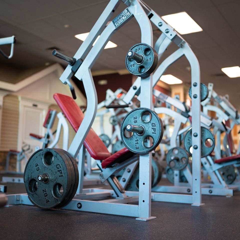 A premium shoulder press machine at Maximus Gym in Riverhead