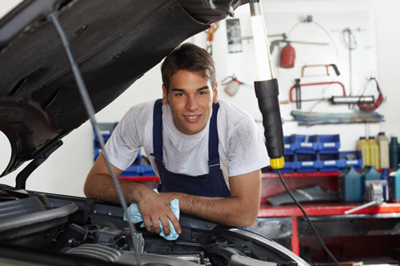 Mechanic working on car 400