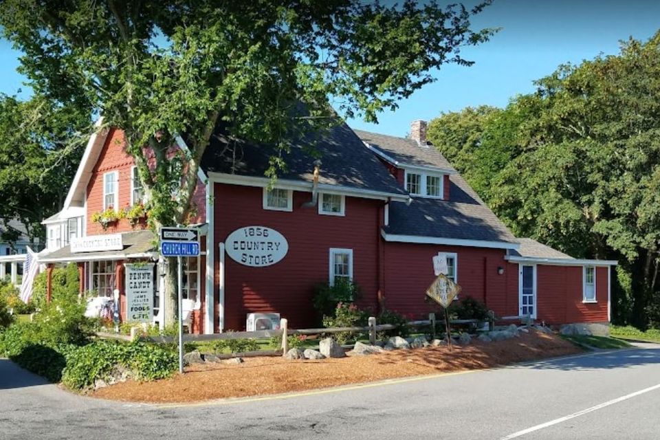 a Red Building, with a white oval sign '1856 Country Store'.  At the corner of a one way street