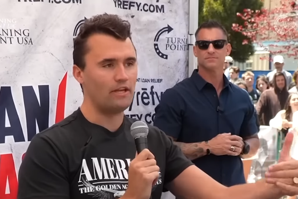 Charlie kirk talking to hispanic student