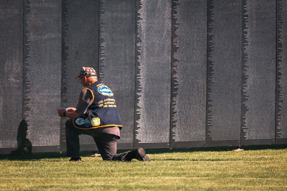 Vietnam veteran kneeling at twth