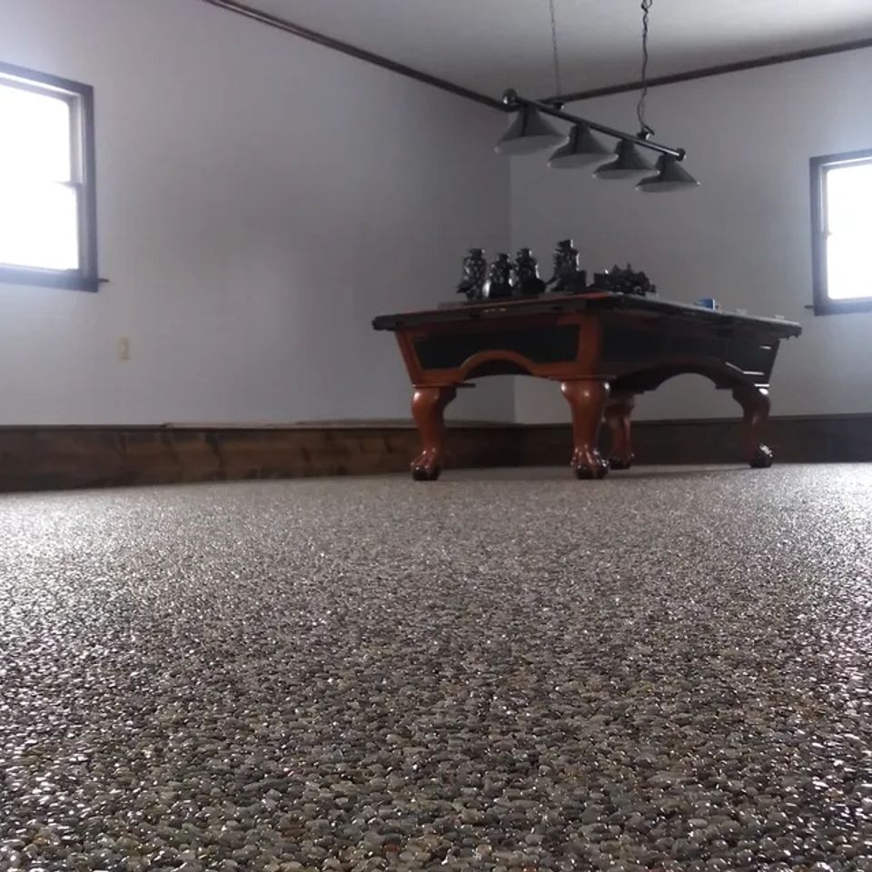 Recreation room with a pool table and EverStone Epoxy Stone flooring.