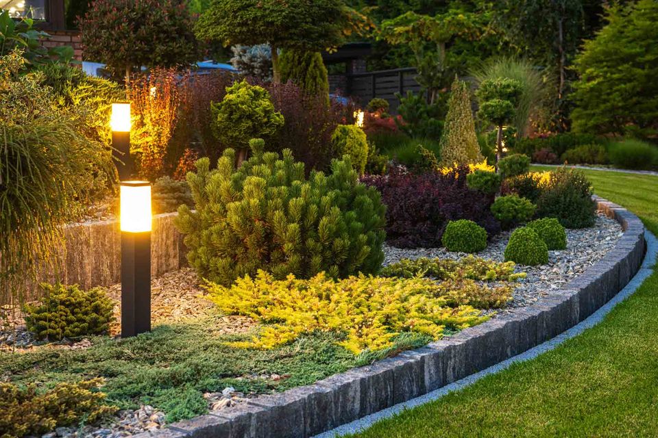 Homeguide outdoor landscape lighting in flower plant beds