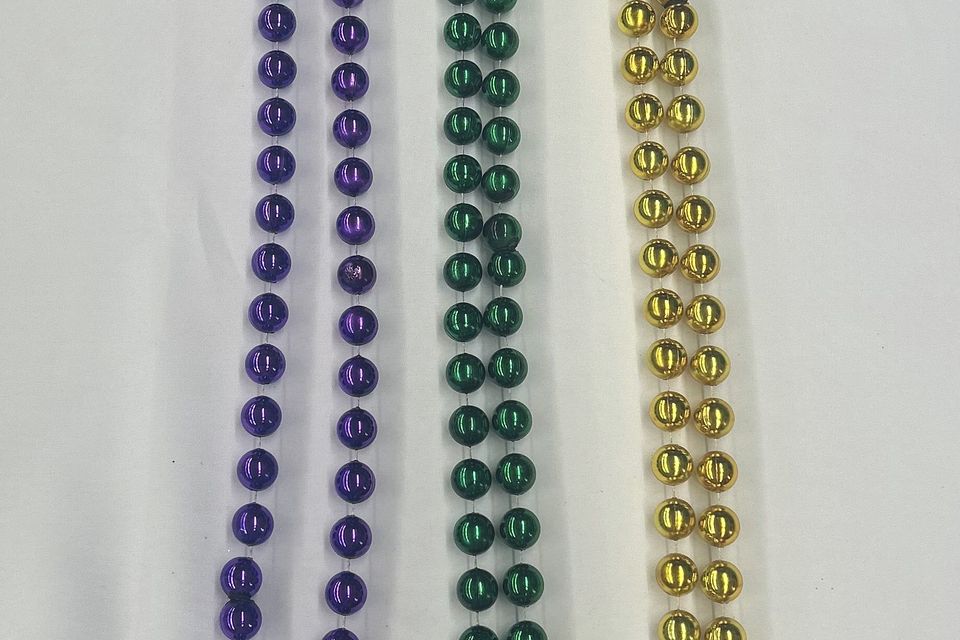 14mm round beads in purple, green and gold.