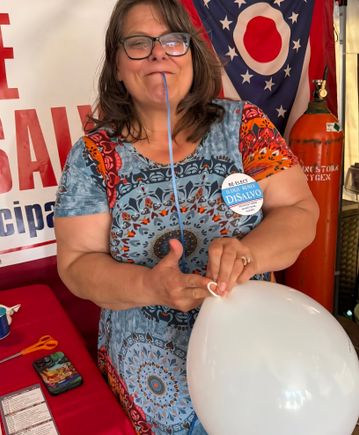 Patty blowing up balloons