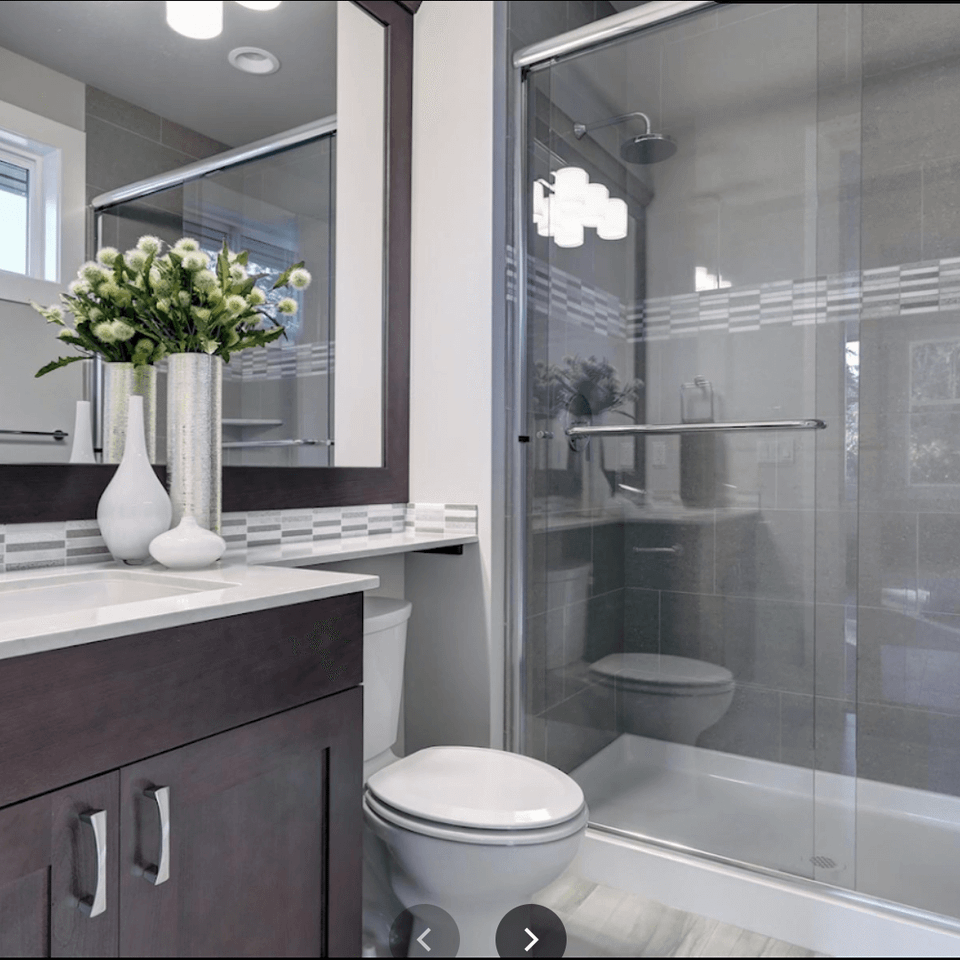 Modern bathroom remodel with a walk-in shower and custom tile work in Knoxville TN.